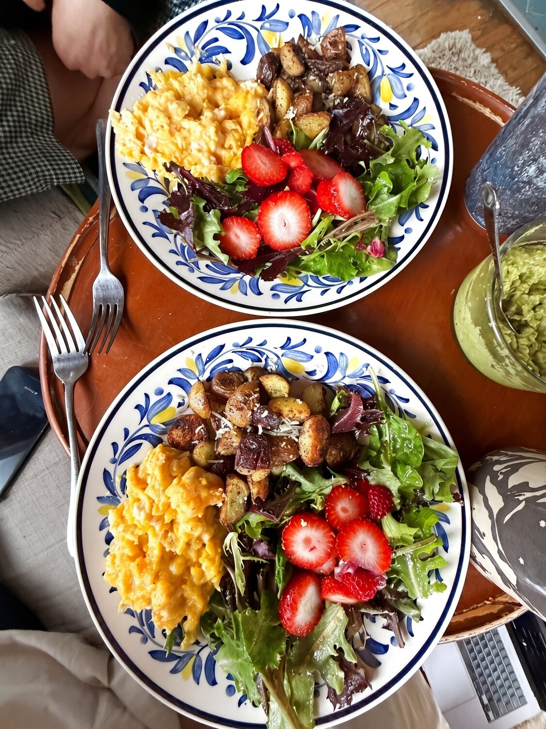 Vibrant bowls with fruit, eggs and greens